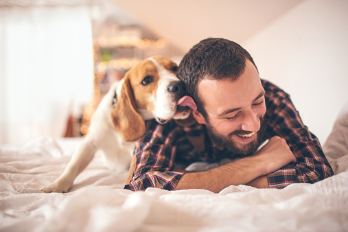 Young man affectionate with his dog